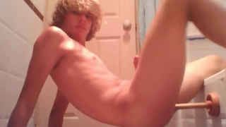 Cute blond teen boy using toilet brush to fuck his ass