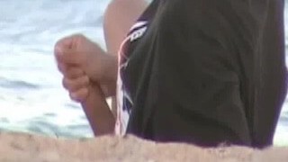 Guy caught masturbating at the beach