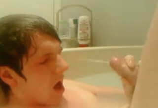 Teen boy cums on his face in the bath tub
