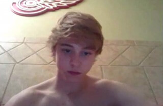 Naked blond boy wanking on bathroom floor