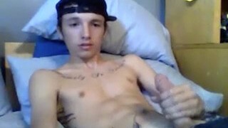 Young tattoo twink masturbating on cam