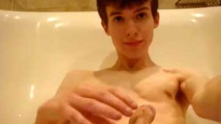 Sweet twink jerks off and cums in the bath tub
